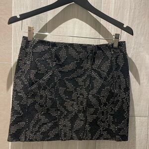 Maje mini skirt size 34 (XS), black. 2 front pockets.